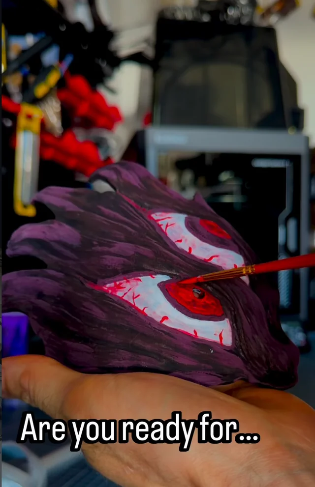 Behind the Work from Impossible Pleasure. Hand-painting the eyes and facial details on a Sukuna mask.