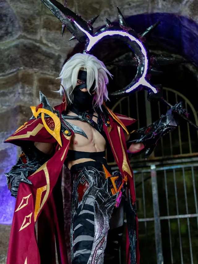 Armored fantasy cosplay portrait with black, red and gold handcrafted costume details.