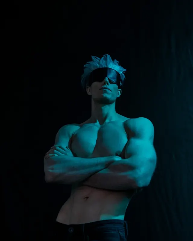 Blue-lit athletic character portrait with a blindfold and dramatic studio lighting.