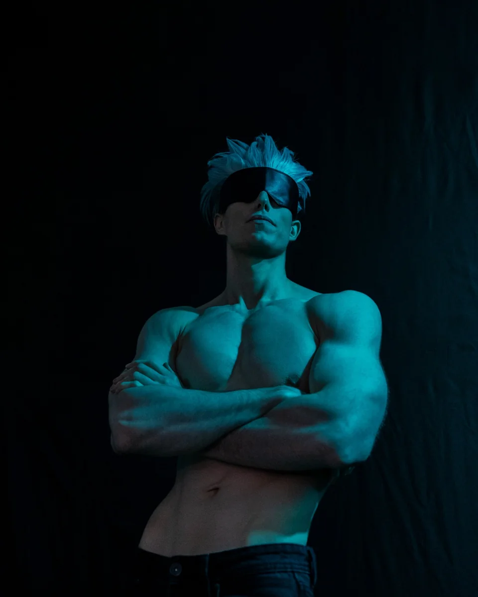 Blue-lit athletic character portrait with a blindfold and dramatic studio lighting.