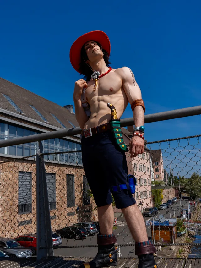 Full-body Portgas D. Ace cosplay with the sewn costume and handcrafted character details.
