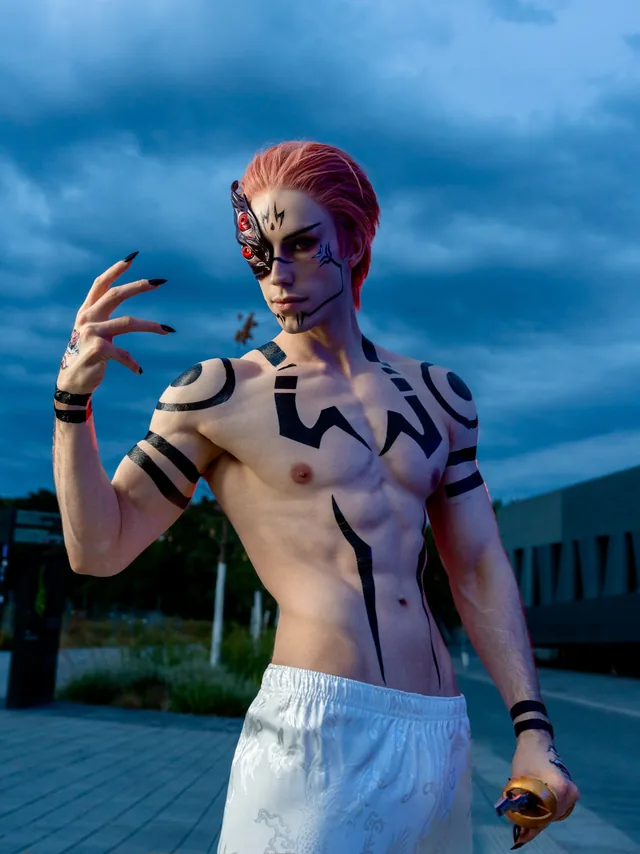 Sukuna cosplay portrait with the 3D-printed eye mask and painted body markings.